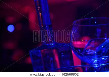 bottle and glass in the nigth club