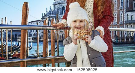 Happy Mother And Child Travellers Holding Venetian Mask, Venice