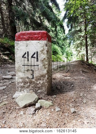 Post sign on mountain trail in the forrest