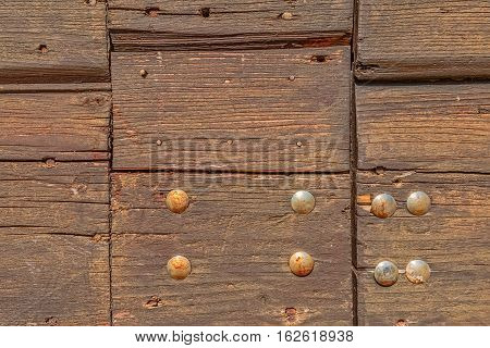 Detail of old wooden door of the typical house in Tucepi village, Croatia.