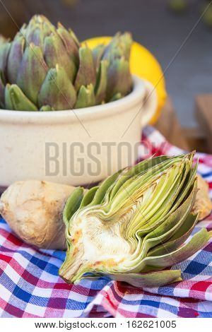 Ripe Organic Artichokes On The Wooden Lattice