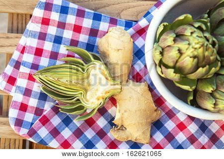Ripe Organic Artichokes On The Wooden Lattice