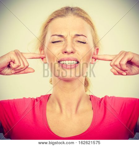 Woman Closing Ears With Fingers, Big Noise.
