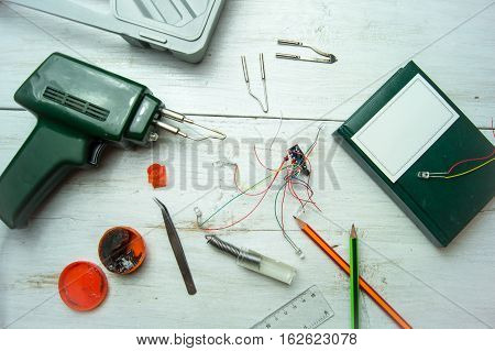 Set-up of various hand and electric tools for repair on white background