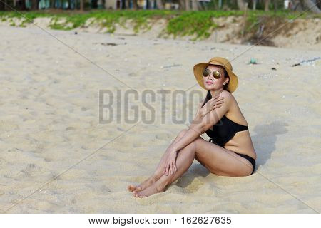 Lady relax on sand in Ban Krut Beach at Prachuap Khirikhun Province Thailand