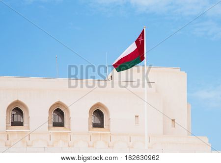 The flag of Oman at The Royal Opera House in Muscat one of many cultural projects initiated by Sultan Qaboos bin Said al Said.
