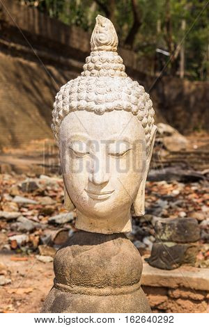 Old Head Buddha statue in Wat Umong, Chiang Mai Thailand