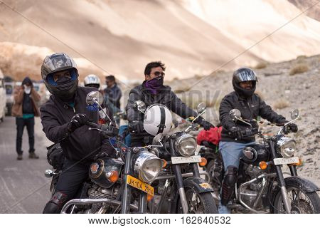 LADAKH, INDIA : 22 JULY 2016 - motorbike group stopped motorbike on the road waiting for maintenance land slide road at entry of Pangong lake in Ladakh, India on Jul 22,2016.
