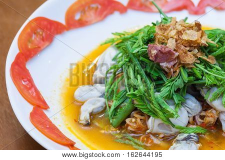 Spicy Oysters Salad with Young Tamarind Leafs