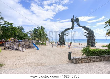PLAYA DEL CARMEN MEXICO - NOVEMBER 8 2016: A playground for children in front of the Mayan monument on the beach makes Playa del Carmen a family-friendly Mexican Riviera travel destination.