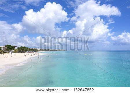 PLAYA DEL CARMEN MEXICO - NOVEMBER 8 2016: Beautiful turquoise water and white sandy beaches with coconut palms and small boutique hotels make Playa del Carmen an attractive vacation destination for tourists from all over the world.
