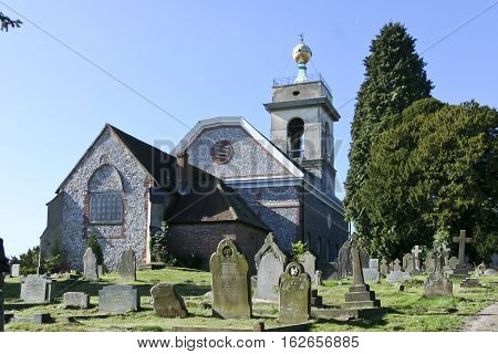 flint walled church on hilltop in west wycombe buckinghamshire uk