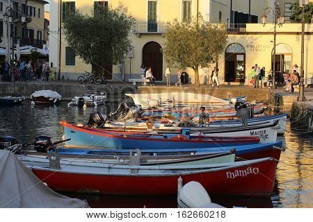 LAZISE ITALY - MAY 5 2016: Small old port in the center of Lazise Lake Garda Verona Italy
