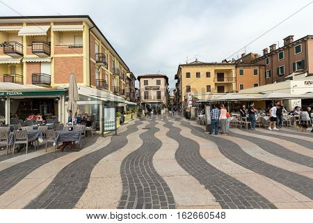 LAZISE ITALY - APRIL 30 2016: Shops bars and restaurants in Lazise at Garda Lake. Italy