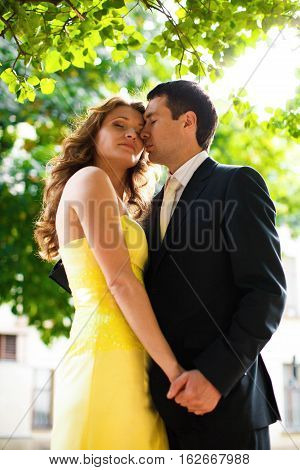 Couple Daydreams Under The Green Treams Holding Their Hands Tightly