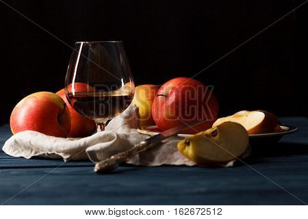 Glass Of Calvados Brandy And Red Apples