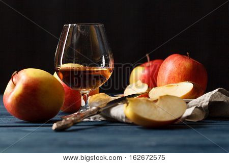 Glasse Of Calvados Brandy And Red Apples