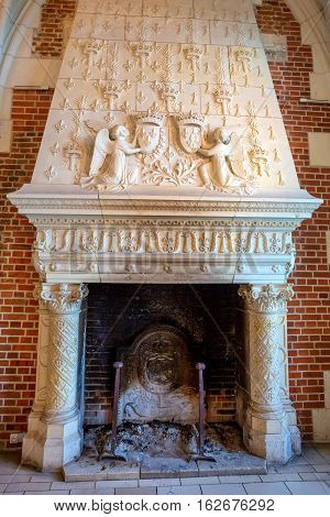 CASTLE OF AMBOISE, AMBOISE, FRANCE - CIRCA JUNE 2014: The fireplace in interior of the Amboise Castle in circa June, 2014. Amboise is chateau in the town of Amboise in the Loire valley, UNESCO World Heritage Site.