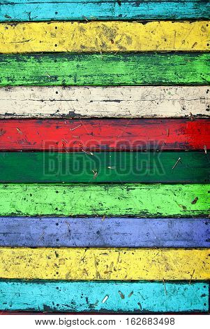 Colorful grungy wooden wall. Seamless background photo texture.