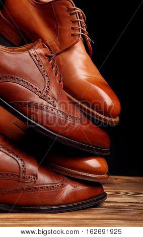 Four Toes One On One Of Brown Shoes Brogues And Derby On The Wooden Table.shoes Shine Concept Of Lux