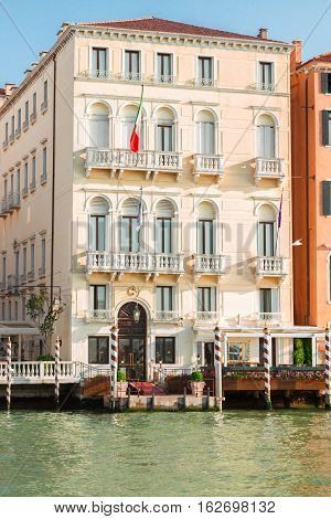 colorful traitional Venice house palazzio over water of canal, Italy