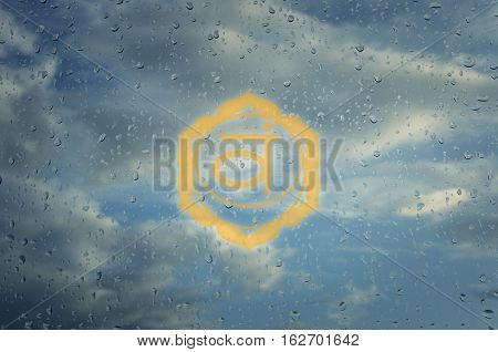 Svadhisthana chakra symbol. Poster for yoga class with a clouds view.