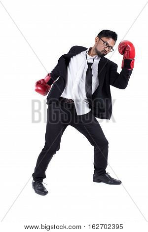 Business man ready to fight with boxing gloves on white background