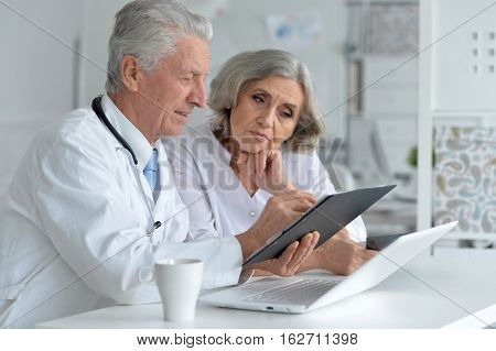 Portrait of a doctor and famale patient in office