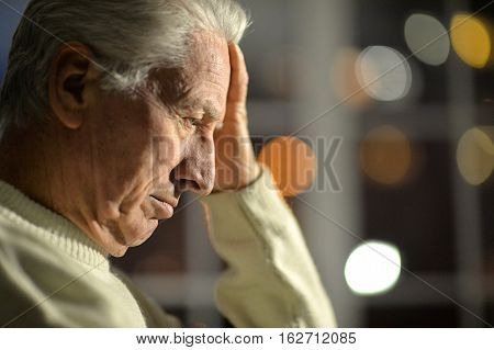 Portrait of a pensive senior man close-up