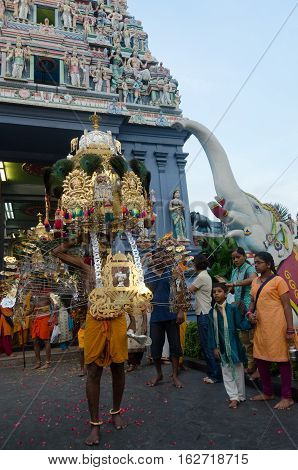 Singapore 7 February 2012: A Hindu devotee carries a kavadi during outside the Sri Perumal Temple at the annual Thaipusam festival.