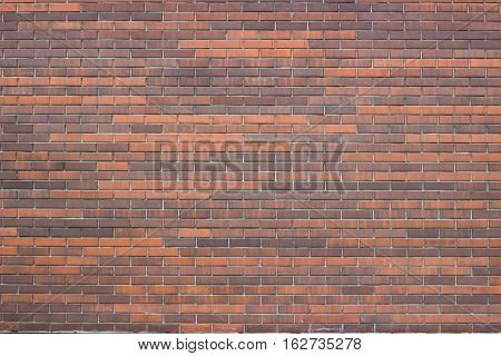 The texture of the brickwork with different shades of brick