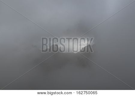 The view of the mountains in the thick fog. Corse France.