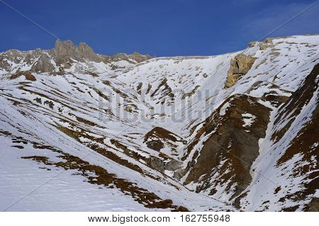 amazing scenic view of snow mountains and ski resort in Switzerland Europe on a cold sunny day with blue sky at Saint Moritz Corvatsch peak in Engadin in winter vacation and holiday concept