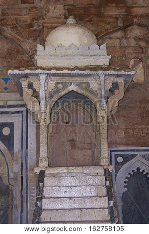 MANDU, MADHYA PRADESH, INDIA - NOVEMBER 18, 2008: Steps leading to a stone platform or mimbar, used by a preacher, inside the prayer hall of  the mosque of Ashrafi Mahal Mosque in the hilltop fortress of Mandu in Madya Pradesh, India. 15th Century AD