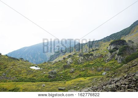 Beautiful Mountain Lake Surrounded By Impressive Mountains Of The Khamar-daban.