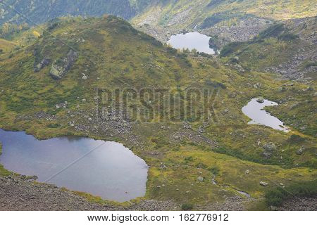 Beautiful Mountain Lake Surrounded By Impressive Mountains Of The Khamar-daban.