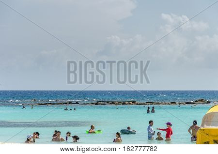 View Of Tourists Enjoying  Baby Beach On Aruba