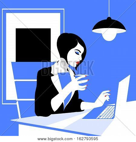 Beautiful young woman working with laptop in her office