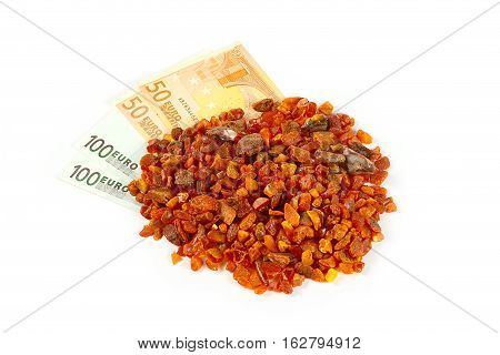 unwrought precious mineral amber and cash Euro banknotes as payment