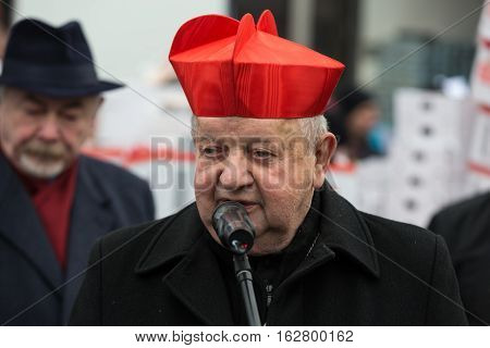 CRACOW POLAND - DECEMBER 18 2016: Cardinal Stanislaw Dziwisz during Christmas Eve for poor and homeless on the Central Market in Cracow.