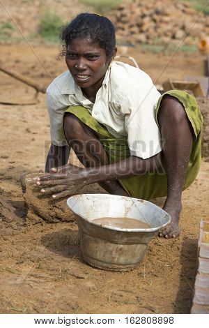 Illustrative image. Pondicherry Tamil Nadu India - July 03 2014. Poor woman worker in small village very hard work for little money roupies