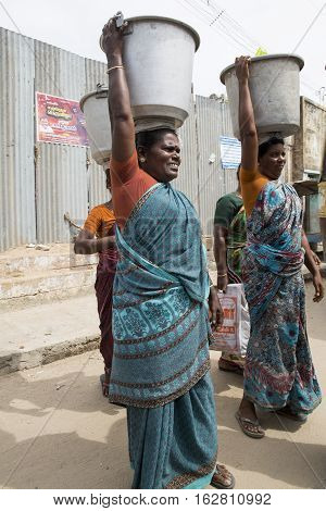 Illustrative image. Pondicherry Tamil Nadu India - July 03 2014. Poor woman worker in small village very hard work for little money roupies