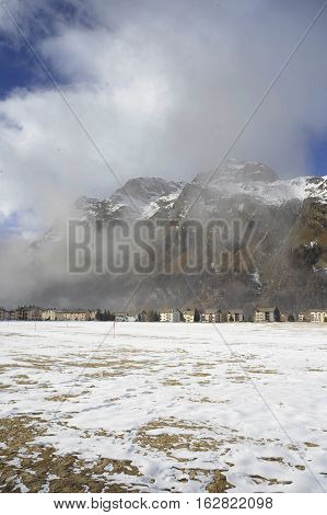 amazing landscape scenic view of Engadin valley in Switzerland Sils Maria village with snow on Alp mountains and frozen ground on a cold sunny winter day in tourism and holiday destination