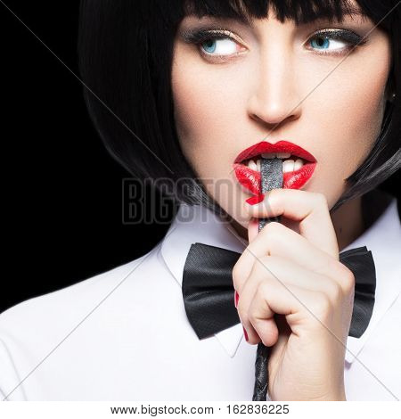 Sexy woman with red lips in wig bite whip bdsm isolated on black