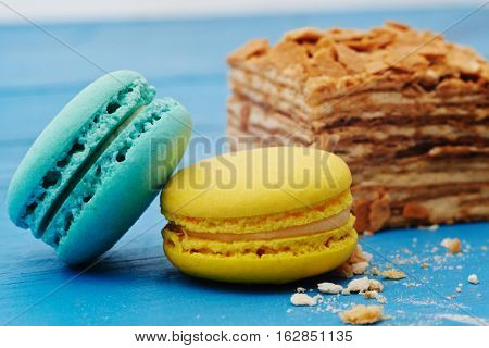 French macaron cookies on a blue wooden table