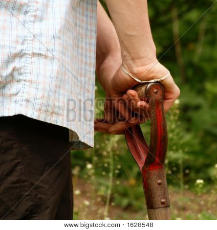Man´S Hands With A Spade