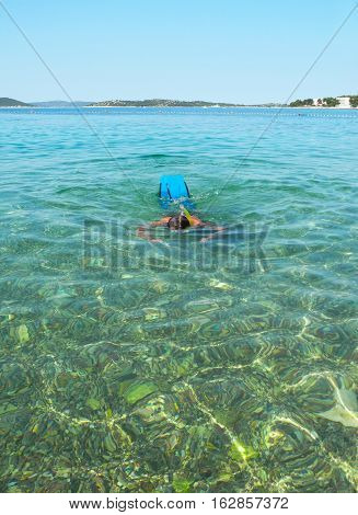 Snorkelling in the clear water of the Adriatic Sea Vodice Croatia.