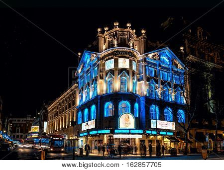 London United Kingdom - December 22 2016: London Cristmas lights decoration at Novello Theatre as seen on 22th of December 2016. Copy space in black sky. Unidentified people present on picture.