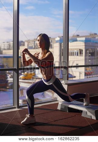 Athletic Couple Doing Exercises Over Steps In Aerobic Class On A Fitness Center. Sport And Health Co