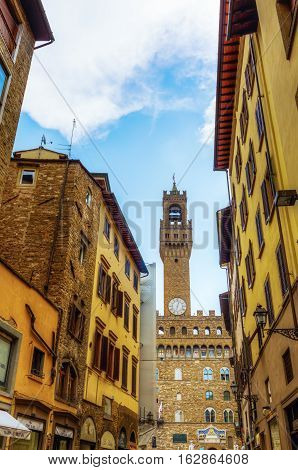 Torre Arnolfo And Palazzo Vecchio In Florence With Unidentified People. The Palace Was The Seat Of T